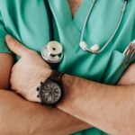 Crop unrecognizable male doctor with stethoscope