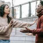 Multiracial couple having conflict on street