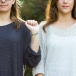 woman showing her wrist with tattoo