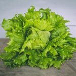 closeup photo of lettuce on gray surface