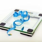 Blue Tape Measuring on Clear Glass Square Weighing Scale