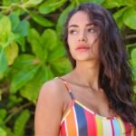 woman in white and red stripe tank top