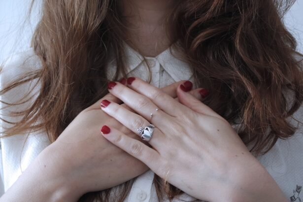woman wearing silver-colored ring